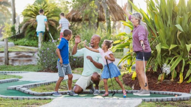 Family playing crazy golf